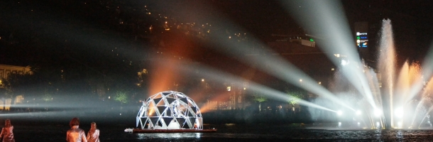 performers approaching floating freedome 30 structure during midnight reflection silent concert